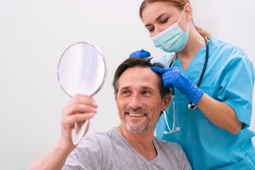 nurse checking hair before treatment